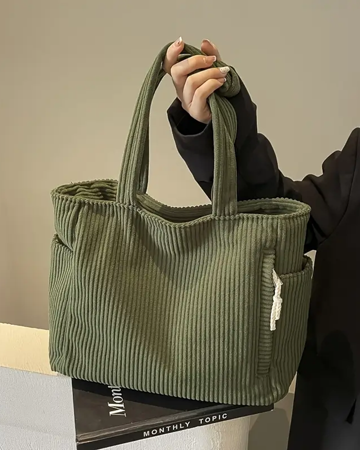 TILDA | BORSA A MANO RIBATTUTA CON DETTAGLI A LACCIO
