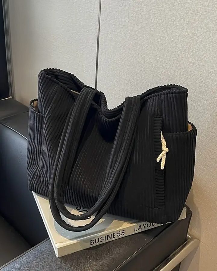 TILDA | BORSA A MANO RIBATTUTA CON DETTAGLI A LACCIO