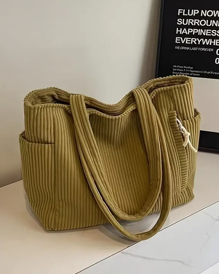 TILDA | BORSA A MANO RIBATTUTA CON DETTAGLI A LACCIO