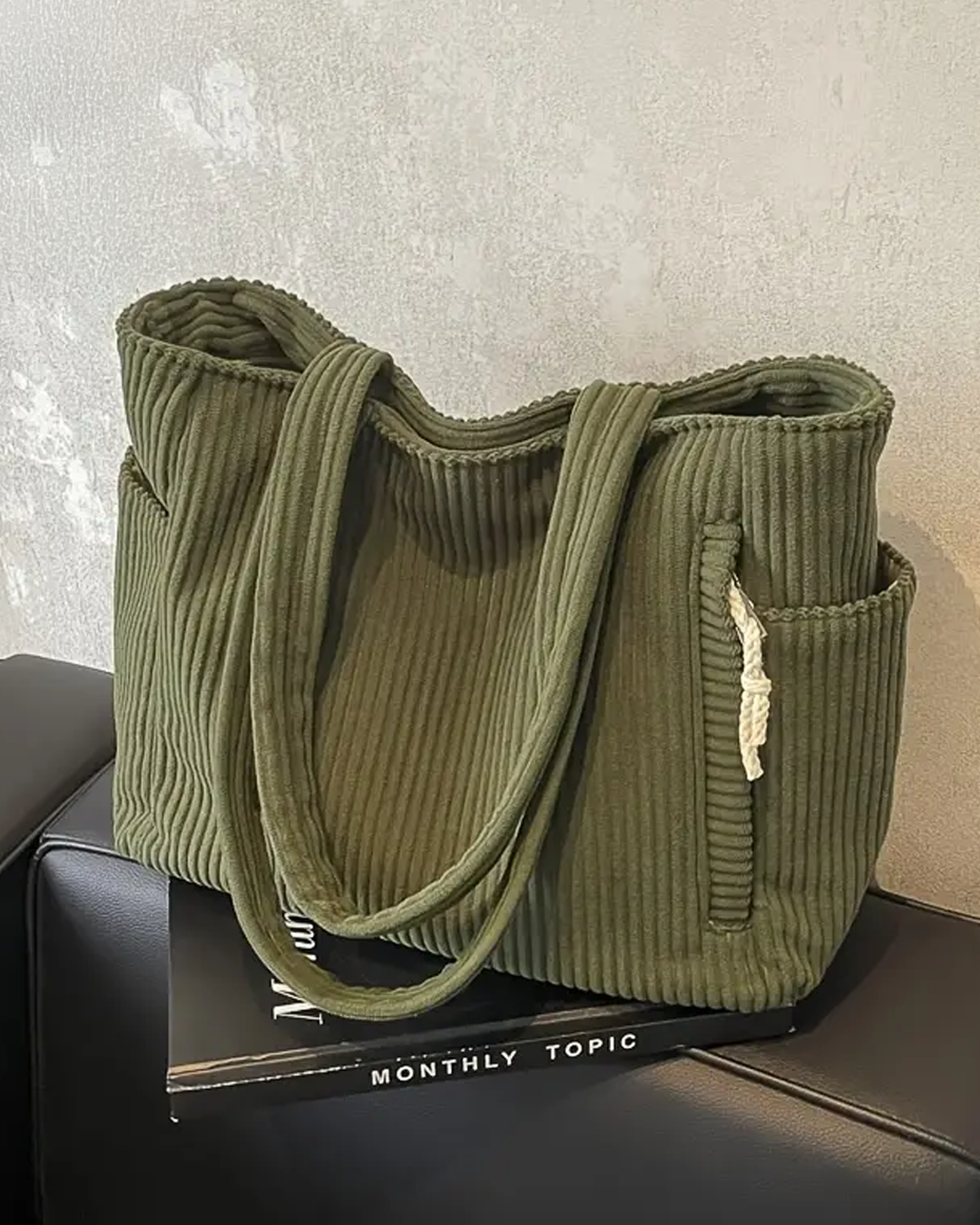 TILDA | BORSA A MANO RIBATTUTA CON DETTAGLI A LACCIO