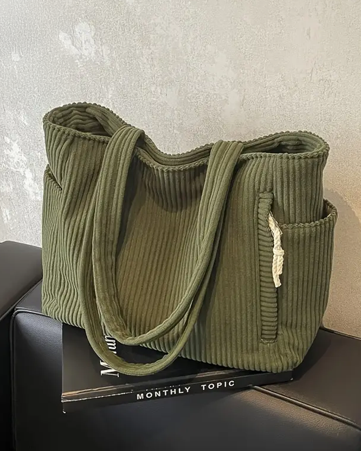 TILDA | BORSA A MANO RIBATTUTA CON DETTAGLI A LACCIO