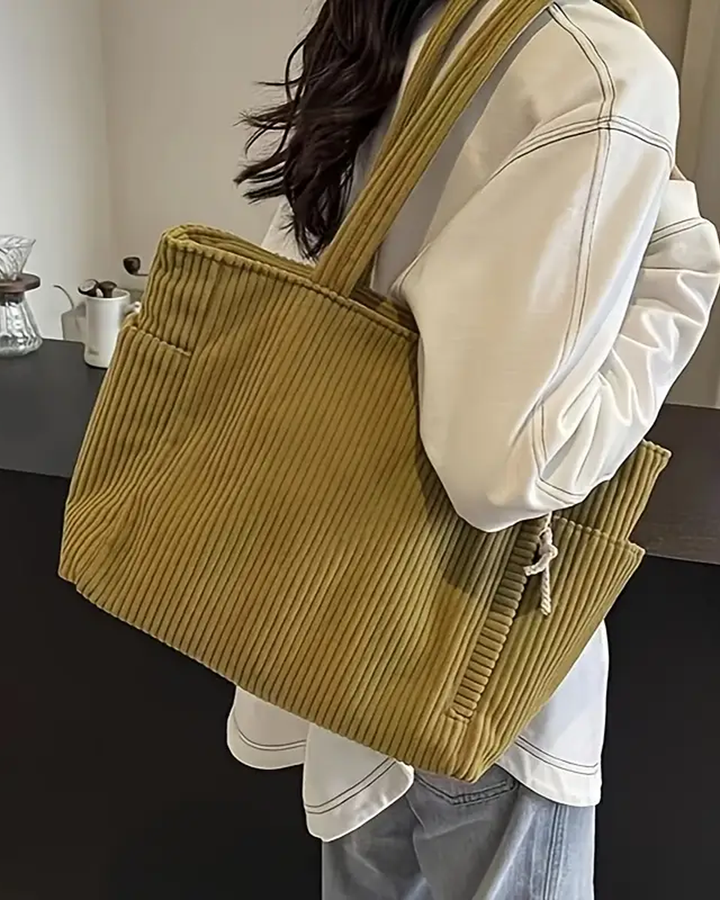 TILDA | BORSA A MANO RIBATTUTA CON DETTAGLI A LACCIO
