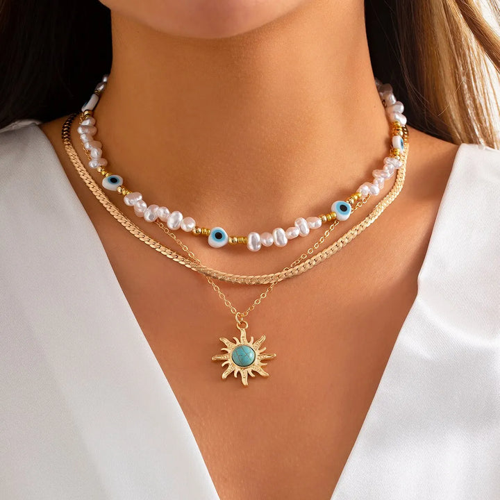Collane a Strati Parel e Occhio Maligno con Ciondolo Sole Boho