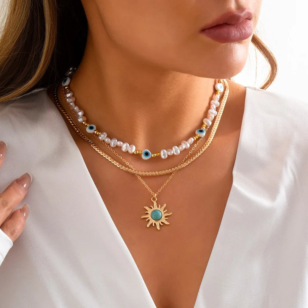 Collane a Strati Parel e Occhio Maligno con Ciondolo Sole Boho