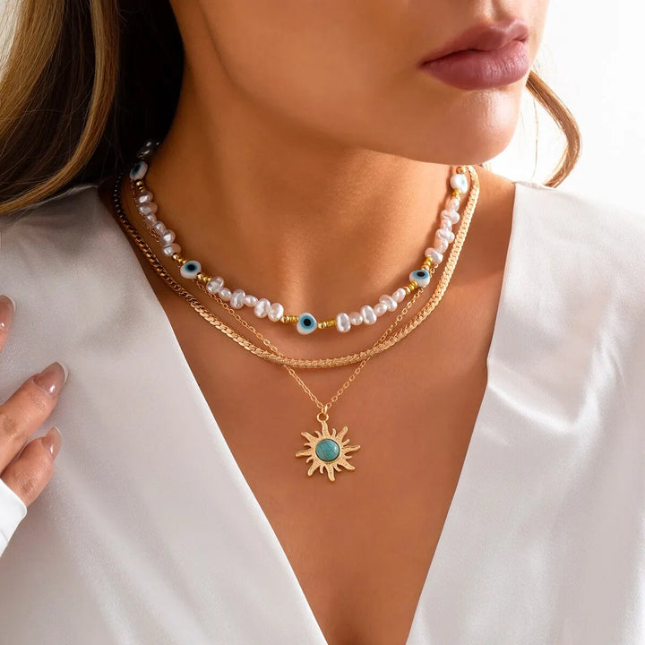 Collane a Strati Parel e Occhio Maligno con Ciondolo Sole Boho