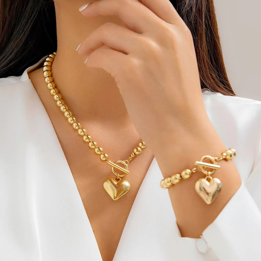 Set di 2 pezzi: bracciale e collana con pendente a cuore in perline