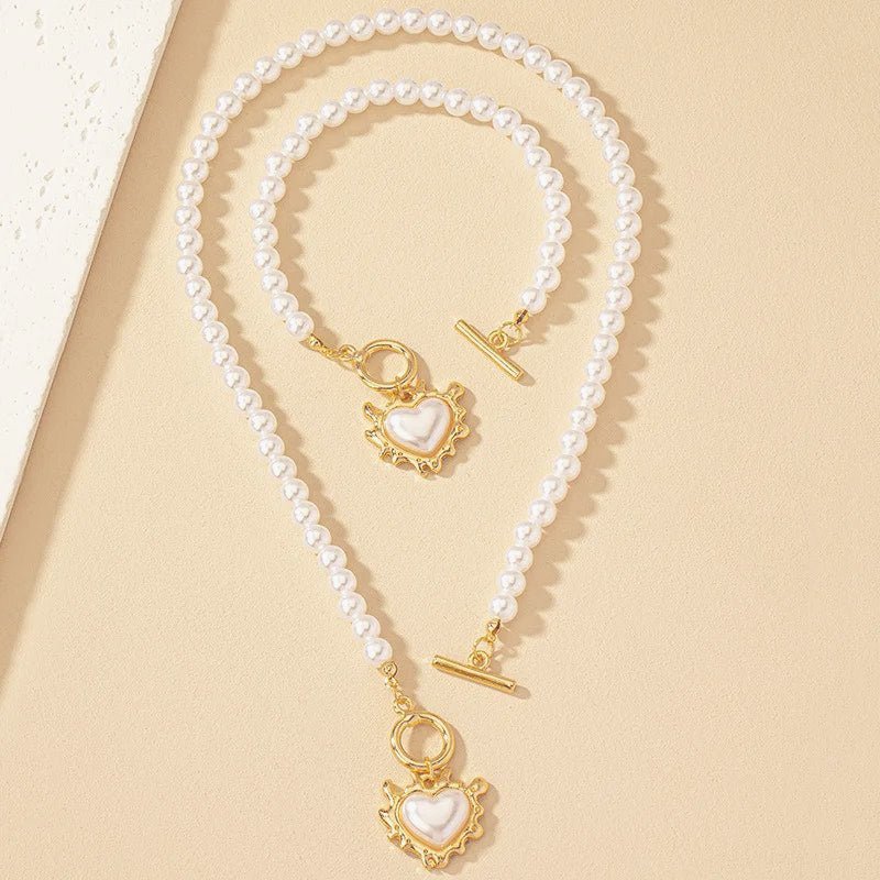 Set di 2 pezzi: bracciale e collana con pendente a cuore in perline