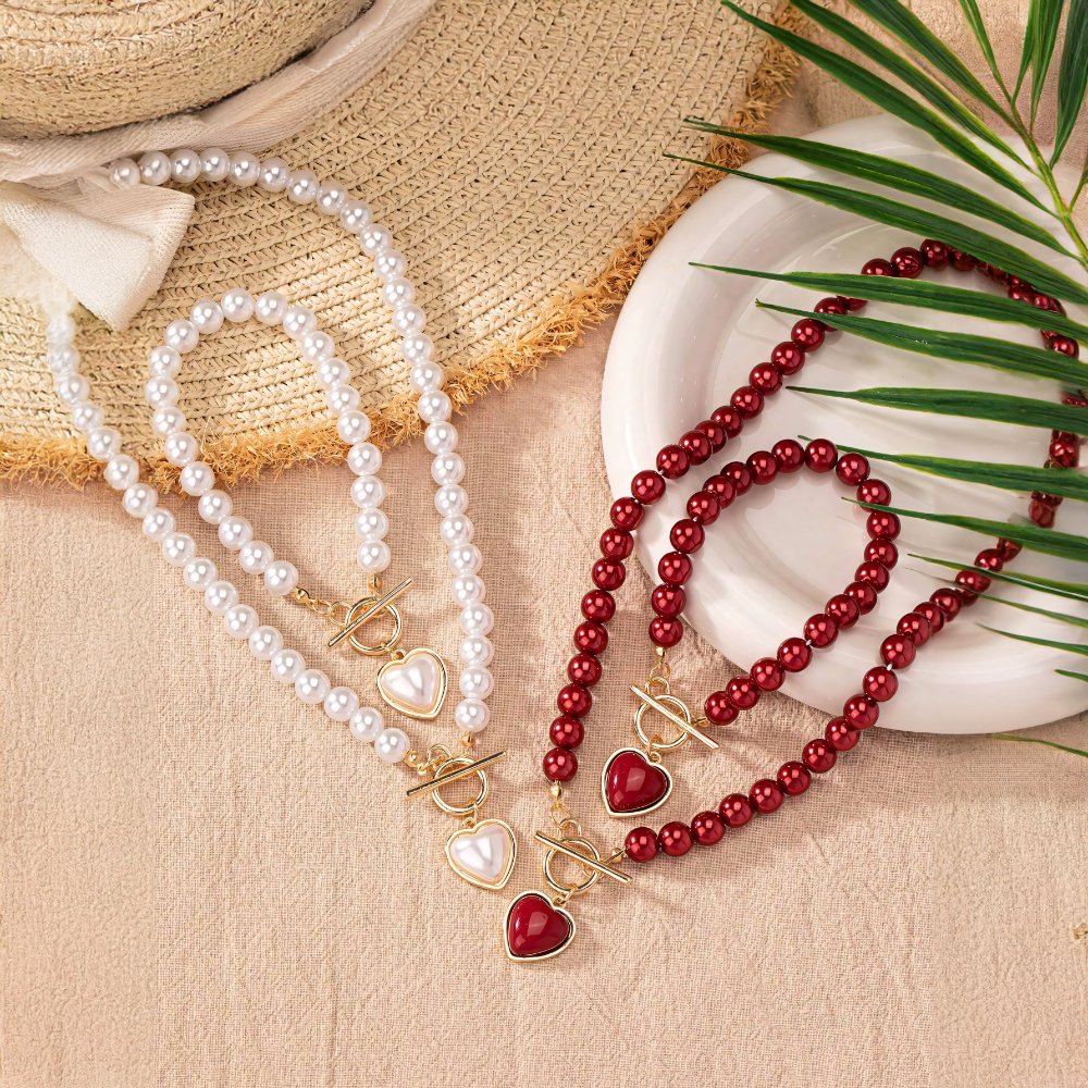 Set di 2 pezzi: bracciale e collana con pendente a cuore in perline