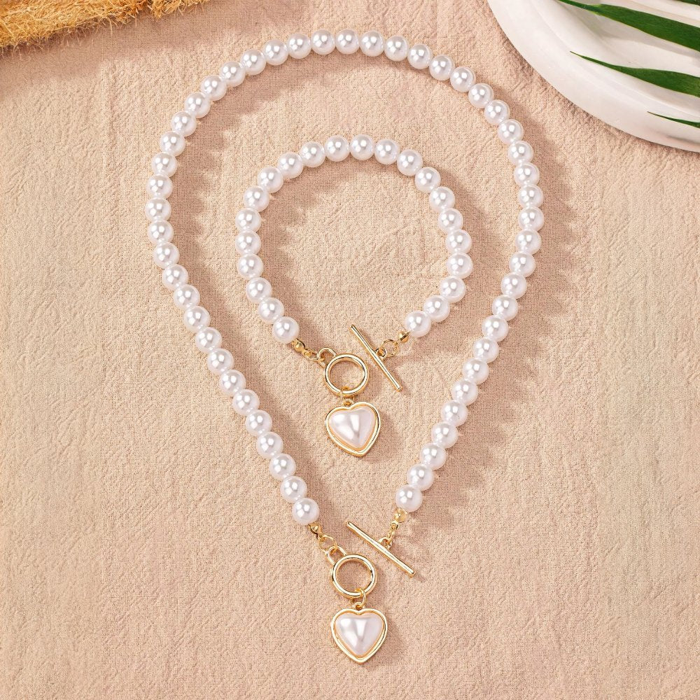 Set di 2 pezzi: bracciale e collana con pendente a cuore in perline