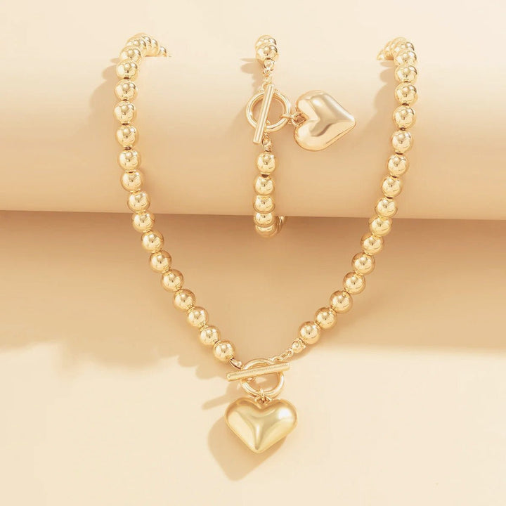 Set di 2 pezzi: bracciale e collana con pendente a cuore in perline