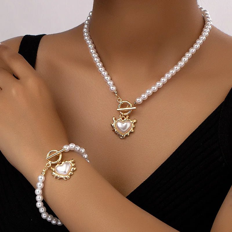 Set di 2 pezzi: bracciale e collana con pendente a cuore in perline
