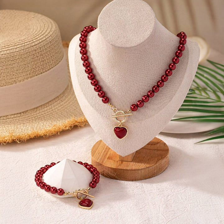 Set di 2 pezzi: bracciale e collana con pendente a cuore in perline