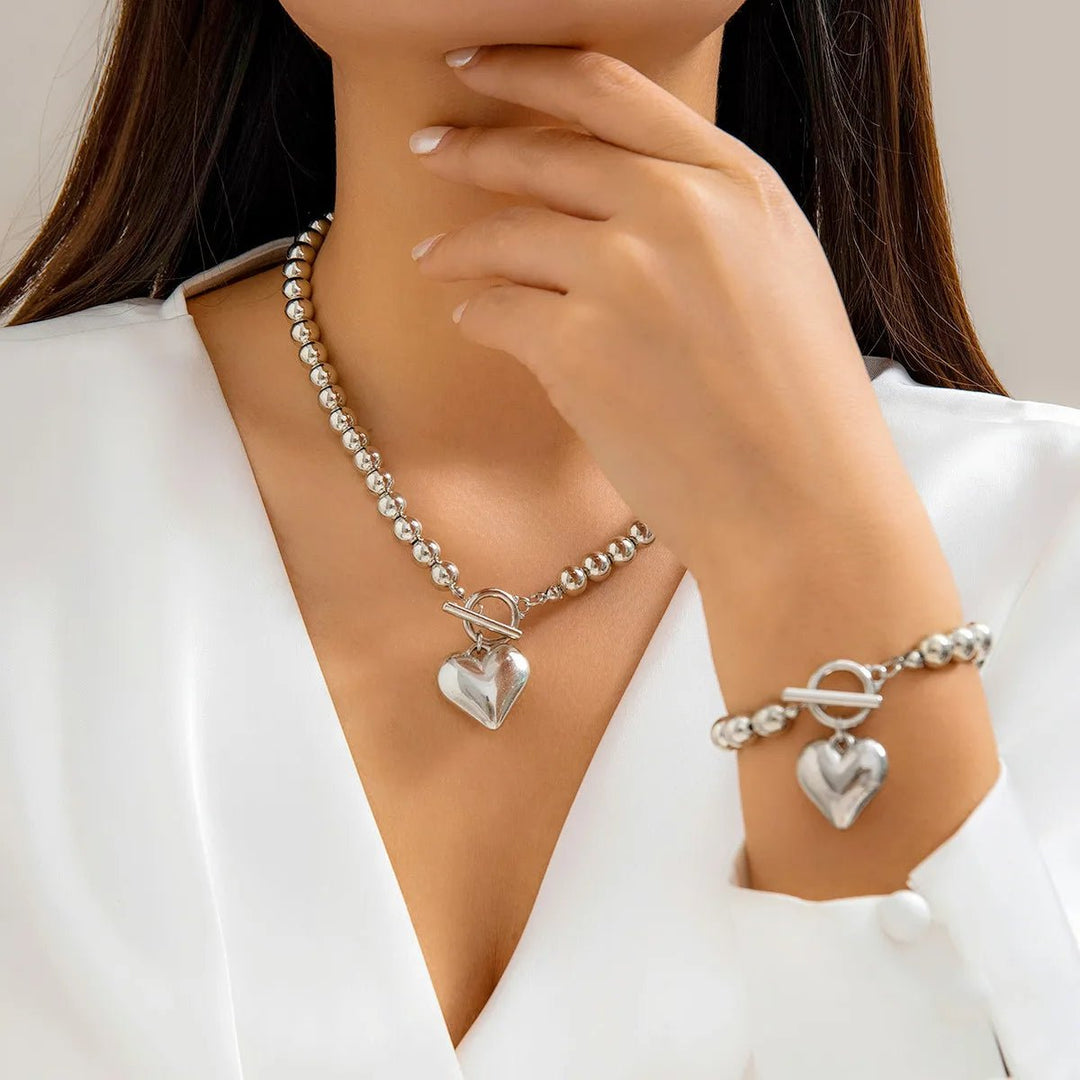 Set di 2 pezzi: bracciale e collana con pendente a cuore in perline