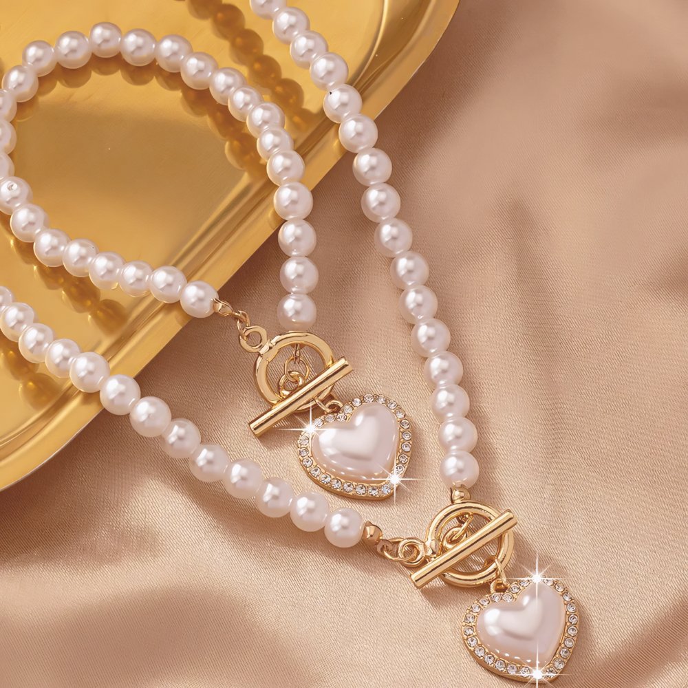 Set di 2 pezzi: bracciale e collana con pendente a cuore in perline