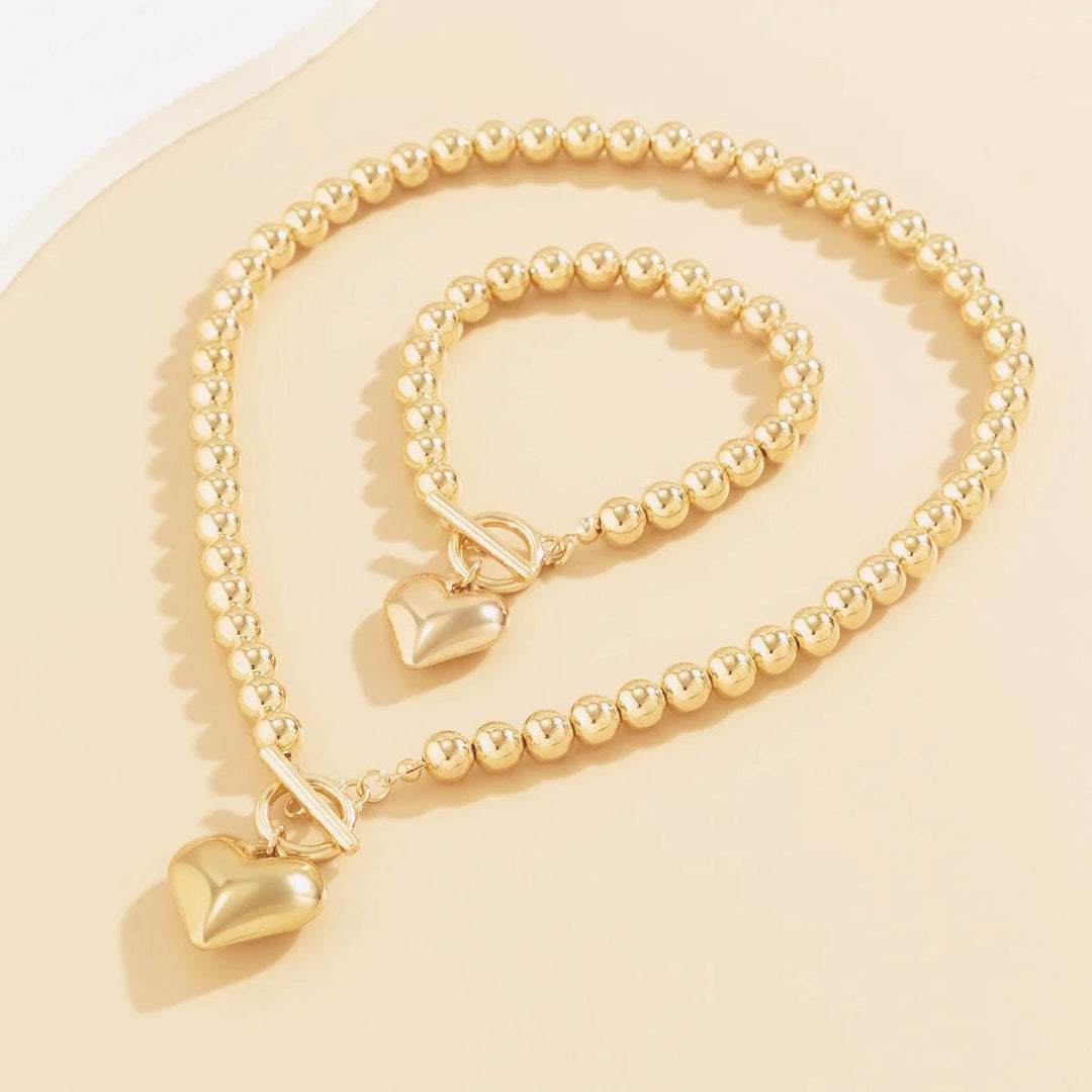 Set di 2 pezzi: bracciale e collana con pendente a cuore in perline