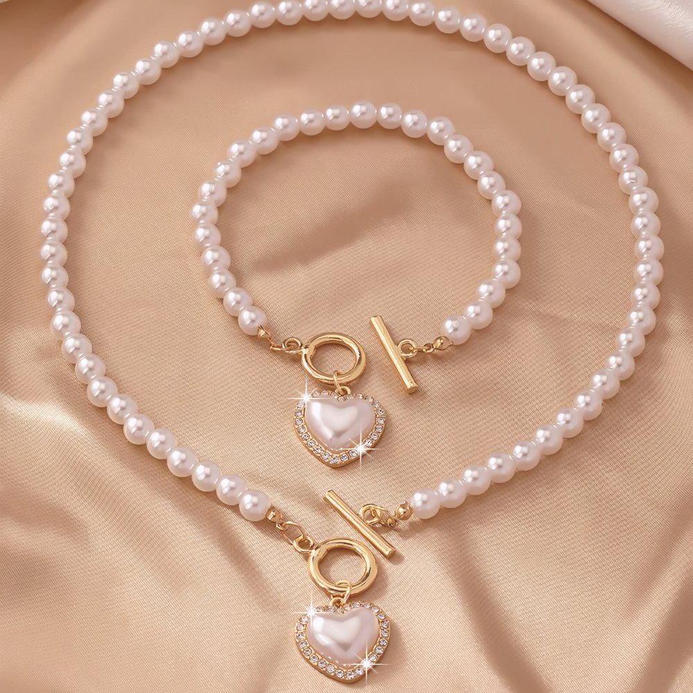 Set di 2 pezzi: bracciale e collana con pendente a cuore in perline