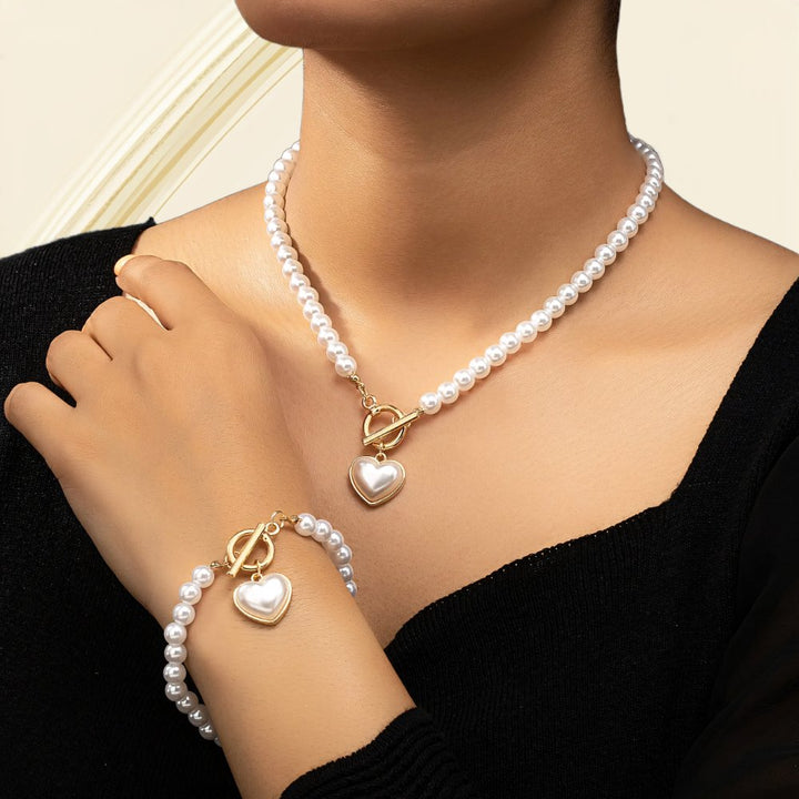 Set di 2 pezzi: bracciale e collana con pendente a cuore in perline