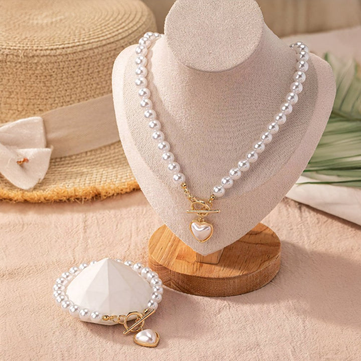 Set di 2 pezzi: bracciale e collana con pendente a cuore in perline