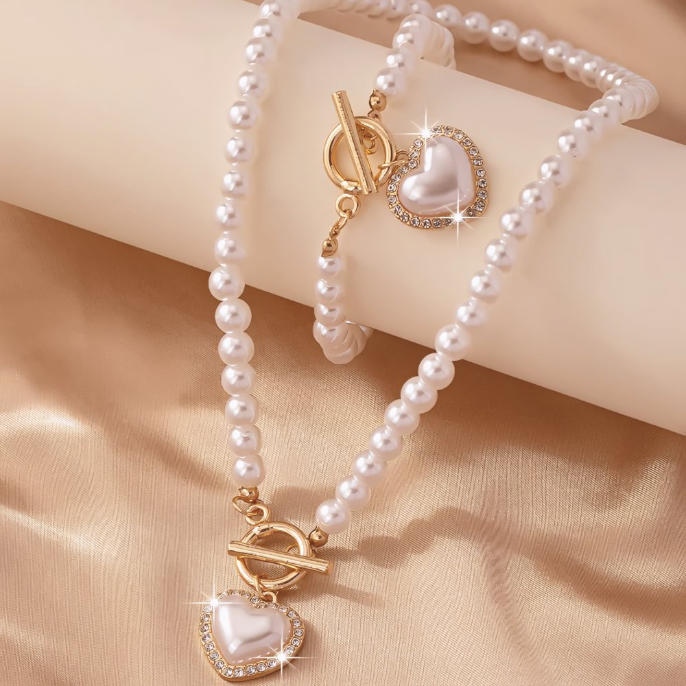 Set di 2 pezzi: bracciale e collana con pendente a cuore in perline