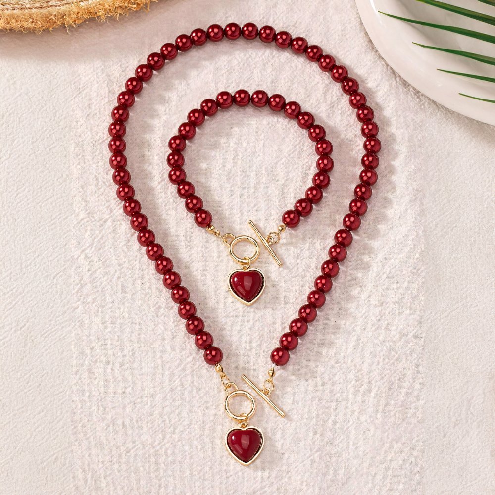Set di 2 pezzi: bracciale e collana con pendente a cuore in perline