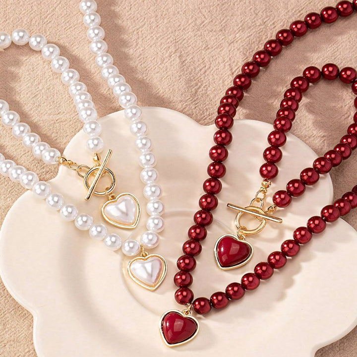 Set di 2 pezzi: bracciale e collana con pendente a cuore in perline
